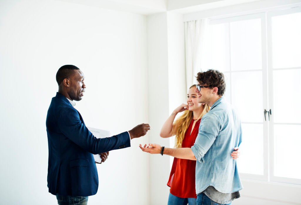 Mastering the Art of How To Buy Houses To Flip With No Money: A Comprehensive Guide 3 real estate agent handing the house key to clients 2022 12 15 23 05 11 utc