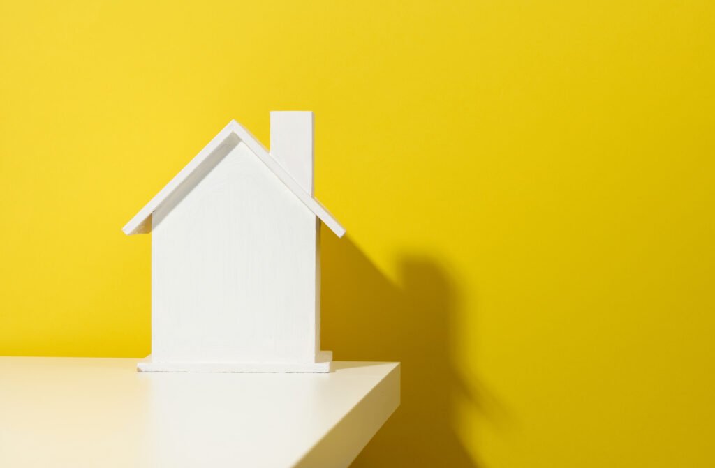 Real Estate Investing Questions: Expert Insights and Answers 3 white wooden house on a yellow background real es 2022 06 21 07 19 35 utc